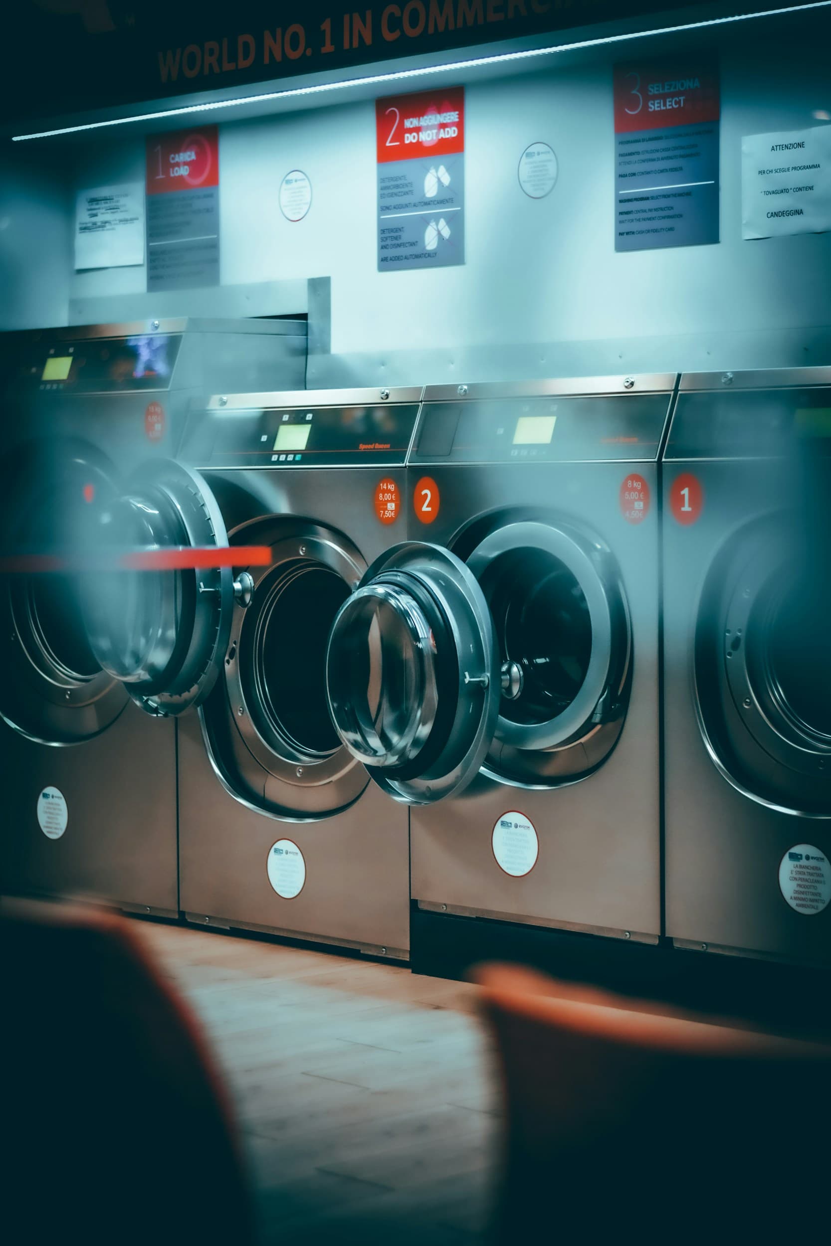 Laundry professional holding freshly folded clothes